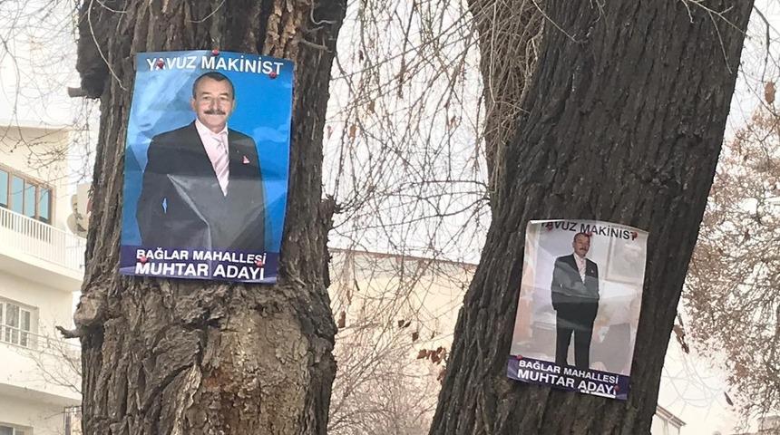 Muhtar adayının afişleri ağa&ccedil;lara asmasına tepki