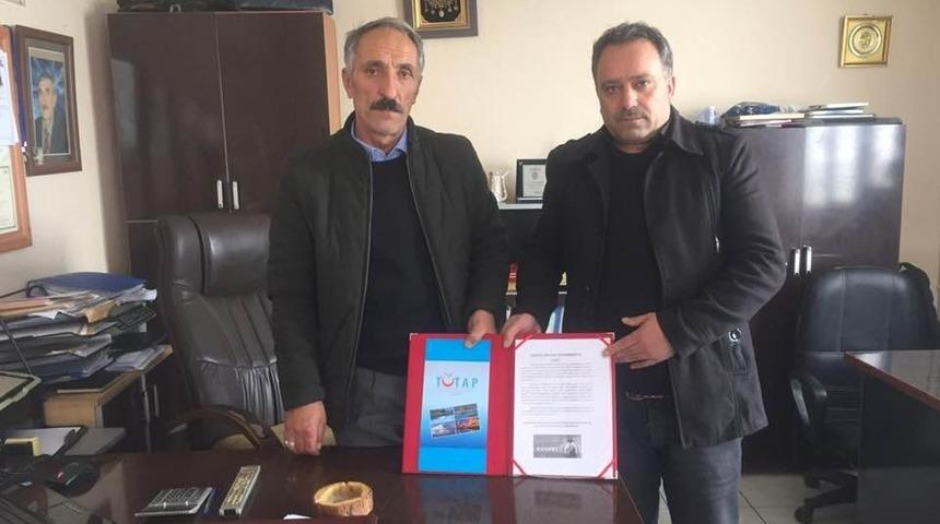 &Ouml;zcan, Tutap temsilcisi oldu