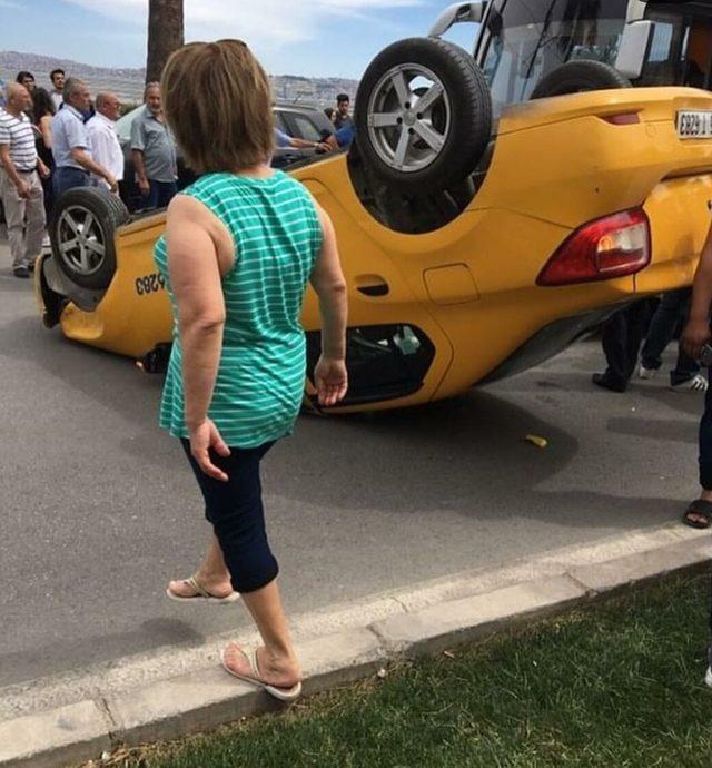 İzmir'de takla atan taksi ters döndü, sürücü yaralandı