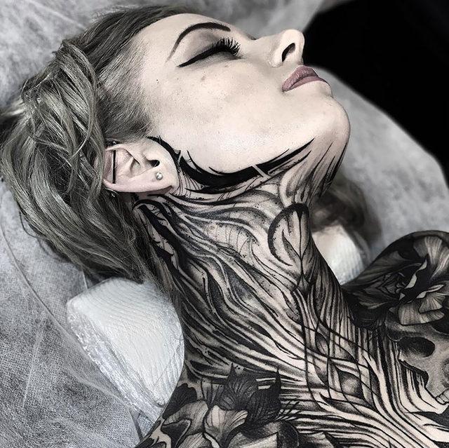 neck-tattoo-designs-58-5cf78ae041697__700