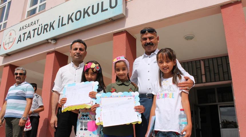 &Uuml;&ccedil;&uuml;z kız kardeşlerin karne mutluluğu