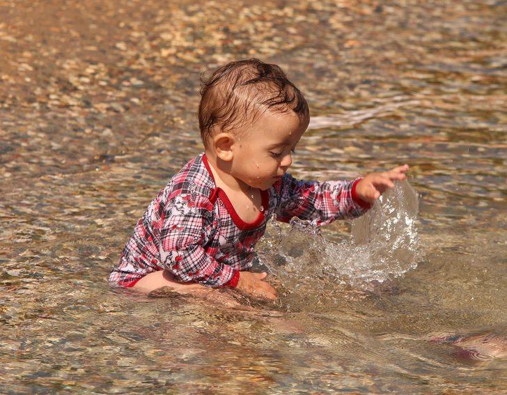 Hava sıcaklıkları 30 dereceyi aştı vatandaşlar soluğu plajda aldı G1