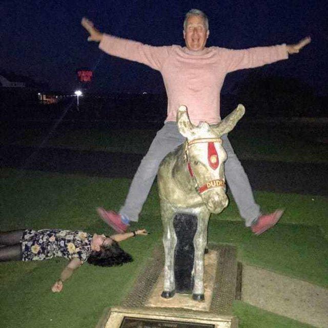 drunk-daughter-lying-on-the-ground-and-drunk-dad-riding-a-statue