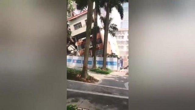 Çin’de bir apartman, birinci katı çökünce yan yattı