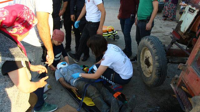 Tamir etmek istediği traktörün altında kaldı