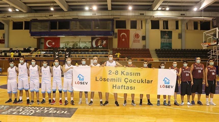 Gediz Elektrik Basketbol Takımı, l&ouml;semili &ccedil;ocuklar i&ccedil;in maske takarak farkındalık oluşturdu