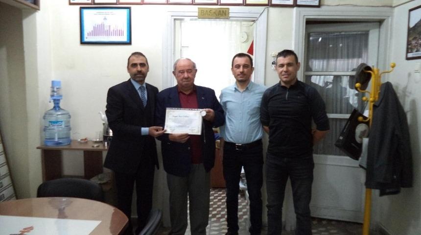 Şakar’a onur belgesi