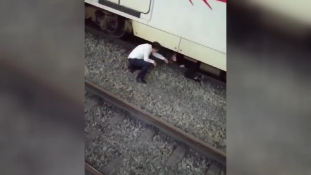 Raylara yatıp intihara kalkışan kadının mucize kurtuluşu