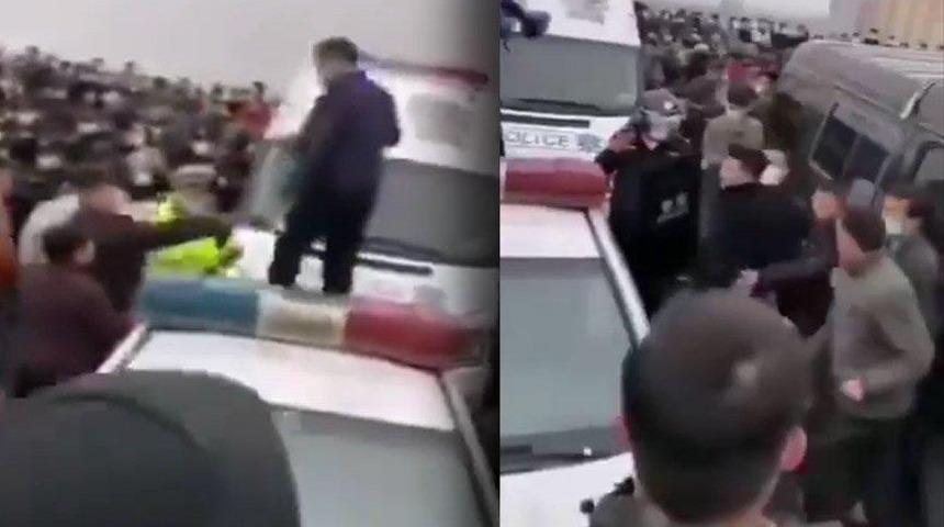 Koronavir&uuml;s salgınının ortaya &ccedil;ıktığı &Ccedil;in&rsquo;in Wuhan kentinde isyan! Polise saldırıp bariyerleri yıktılar 