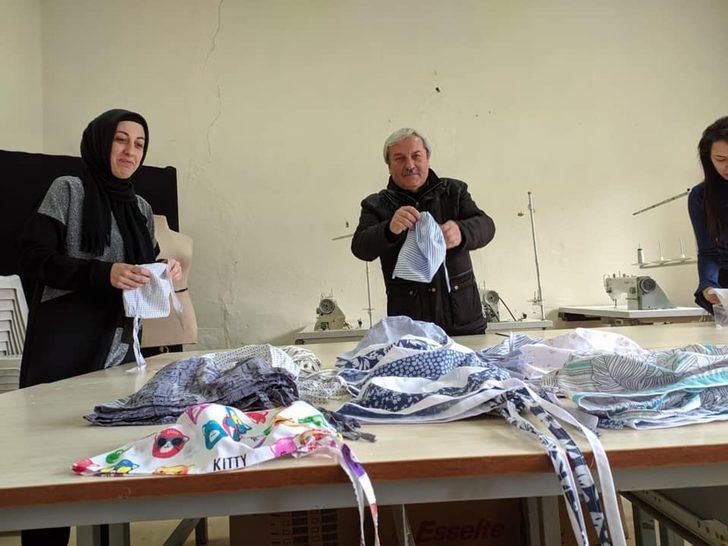 Küçük bir atölyede yüzlerce maske ve bone diktiler G5