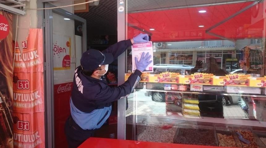Zabıta, işyerlerine uyarı afişi astı