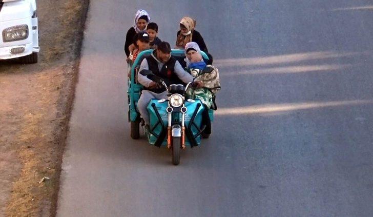 10 kişilik ailesini bir motosiklete bindirdi G1
