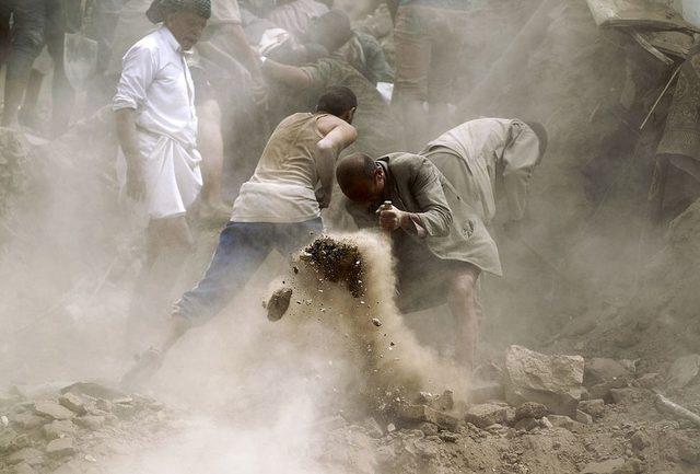People search in Yemen's capital Sanaa following an overnight Saudi-led air strike
