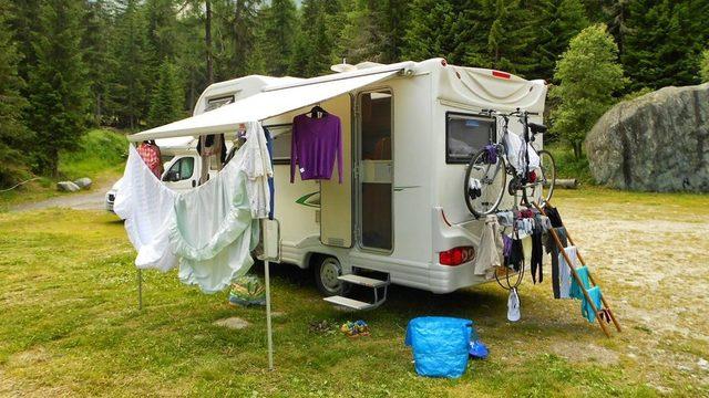 Washing hanging up outside campervan in forest