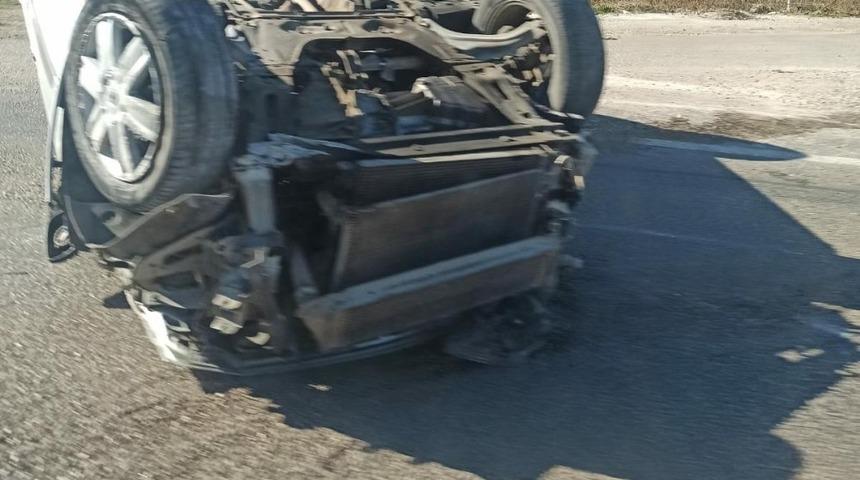 Takla atan otomobilden hafif yaralı kurtuldu