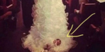 Seeing the baby in the tail of the wedding dress he glared at him 