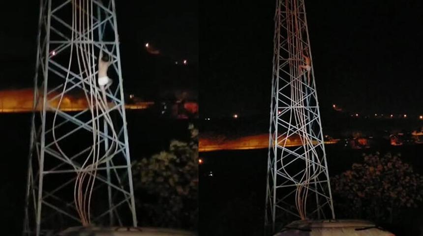 Trafik cezası yiyince yarı çıplak yüksek gerilim hattına çıktı