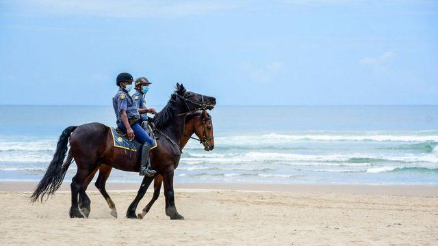 Mounted police during beach closures on December 16, 2020 in Durban, South Africa.