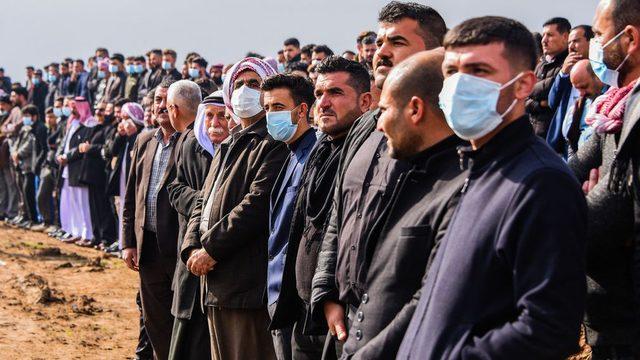 People gather for the mass funeral in Kocho on 6 February 2021