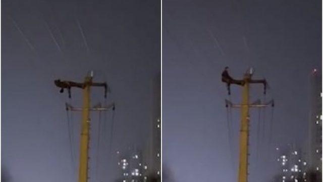 Çin'de elektrik direğinin tepesinde mekik çeken kişi gözaltına alındı