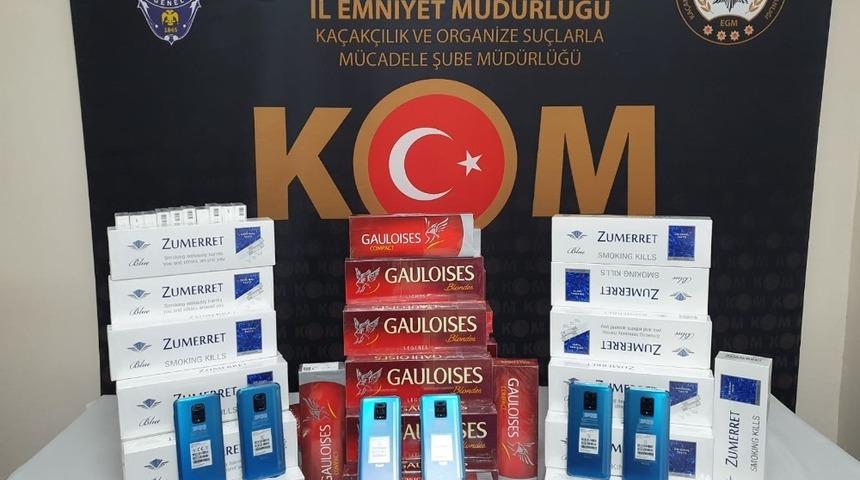 Polisler, ka&ccedil;ak telefon ve sigara ele ge&ccedil;irdi