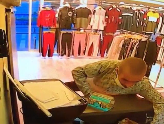 (ÖZEL) Mağazaya giren hırsız, kasasının yanındaki cep telefonunu böyle çaldı 1
