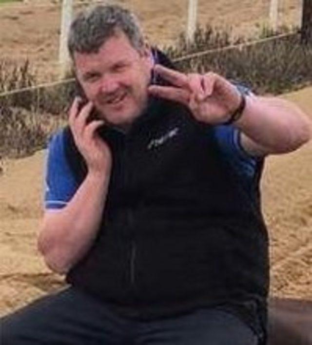 A close crop of Gordon Elliott sitting on a dead horse