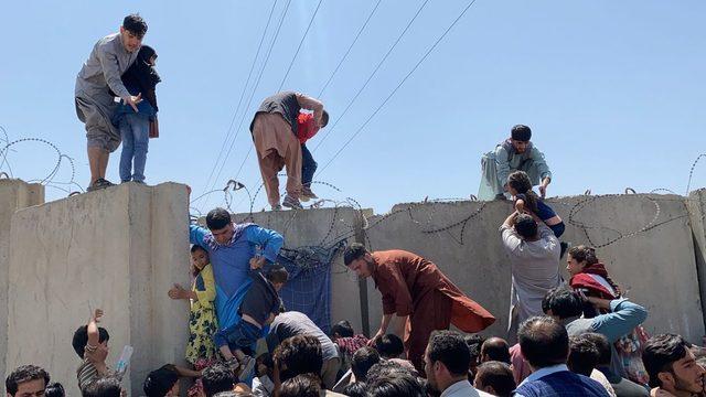 People have been scaling the boundary wall of Hamid Karzai International Airport