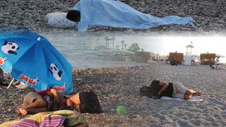 Sıcaktan bunalanlar Konyaaltı Sahili'nde sabahladı