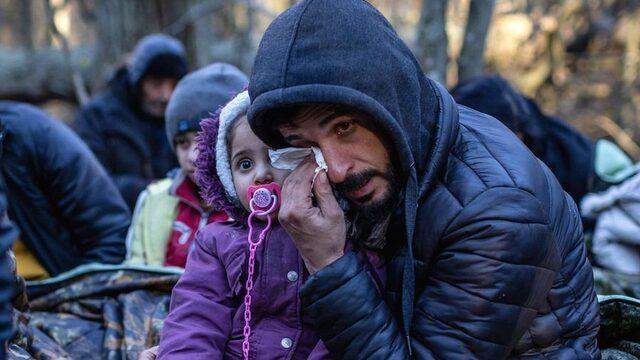 A Kurdish family from Iraq near the Poland-Belarus border