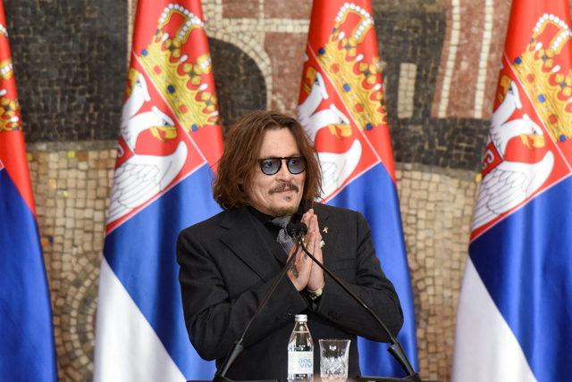 2022-02-15T145016Z_1524953563_RC2EKS90EDDT_RTRMADP_3_SERBIA-JOHNNYDEPP-GOLDMEDAL