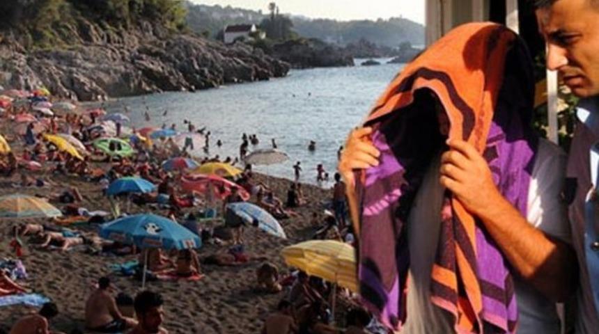 Plajda cep telefonuyla gizli fotoğraf çektiği iddiası