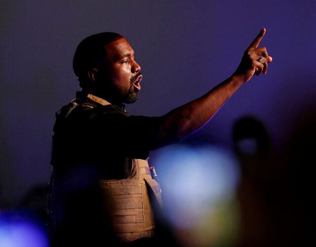 FILE PHOTO: Rapper Kanye West gestures to the crowd as he holds his first rally in support of his presidential bid in North Charleston