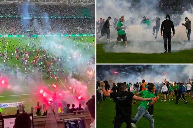 1_BANNER-GRABS-Furious-St-Etienne-fans-chase-own-players-off-pitch-and-launch-flares-after-Ligue-1