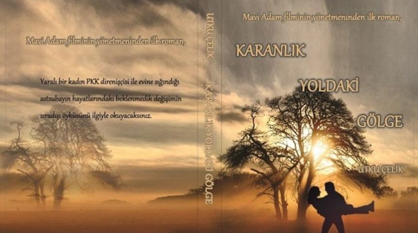 &ldquo;Mavi Adam&rdquo; filminin y&ouml;netmeni Utku &Ccedil;elik'ten ilk roman Karanlık Yoldaki G&ouml;lge &ccedil;ıktı