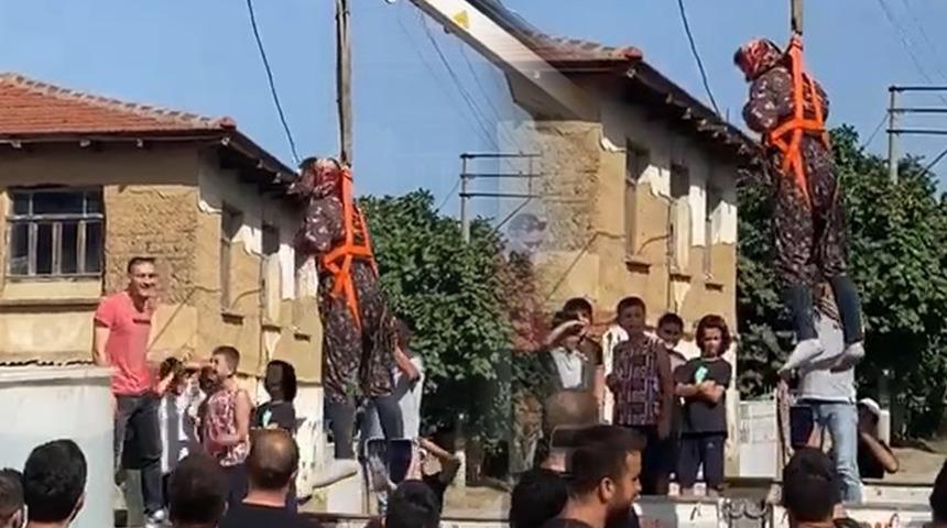 Damadı canın bezdirdiler! Önce şalvar giydirip vince astılar sonra da...