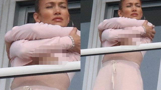 Cenaze için Miami'ye giden Jennifer Lopez, balkonda esnerken göğüslerini ortaya çıkardı 