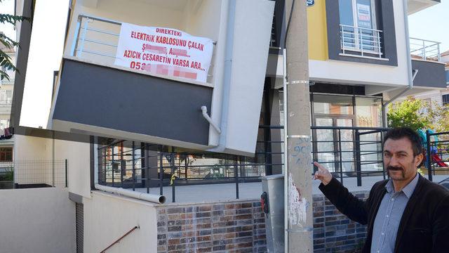 Yeni yaptırdığı binada karşılaştığı manzarayla şoke oldu! Pankart asıp çağrıda bulundu: Azıcık cesaretin varsa... 