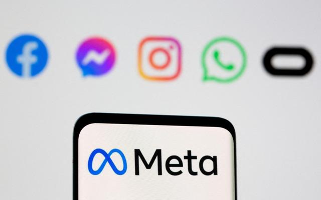 FILE PHOTO: FILE PHOTO: The Meta logo is seen on smartphone in front of displayed logo of Facebook, Messenger, Instagram, WhatsApp, Oculus in this illustration taken
