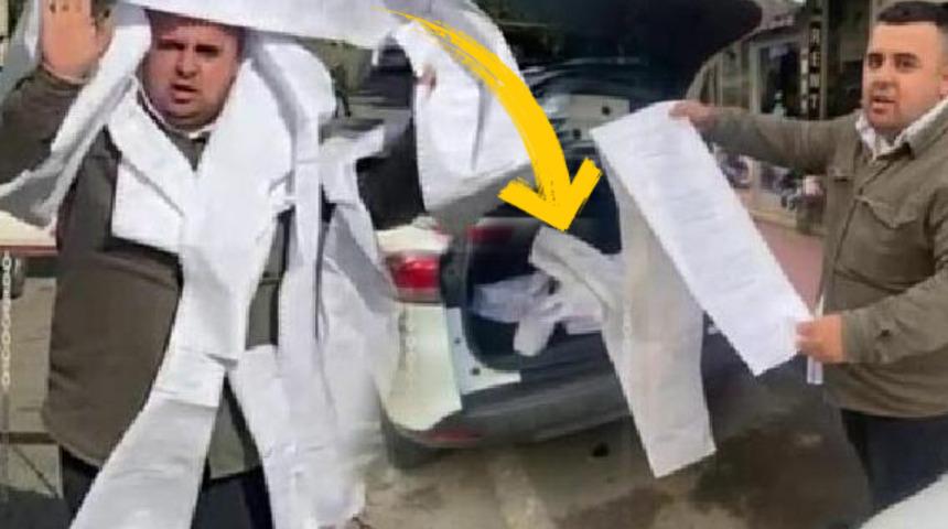 10 metre uzunluğundaki 120 makbuzu boynuna doladı: Ödedim, huzurlu ve mutluyum