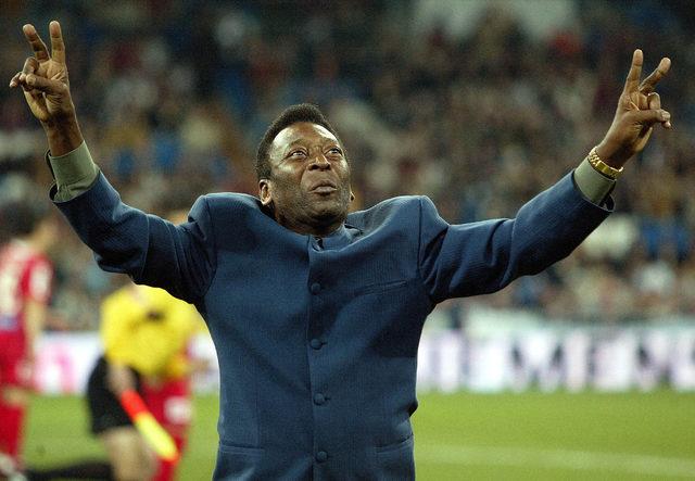 FILE PHOTO: Brazilian soccer legend Pele greets supporters before Real Madrid's First Division soccer match against Real Zaragoza at Madrid's Santiago Bernabeu stadium