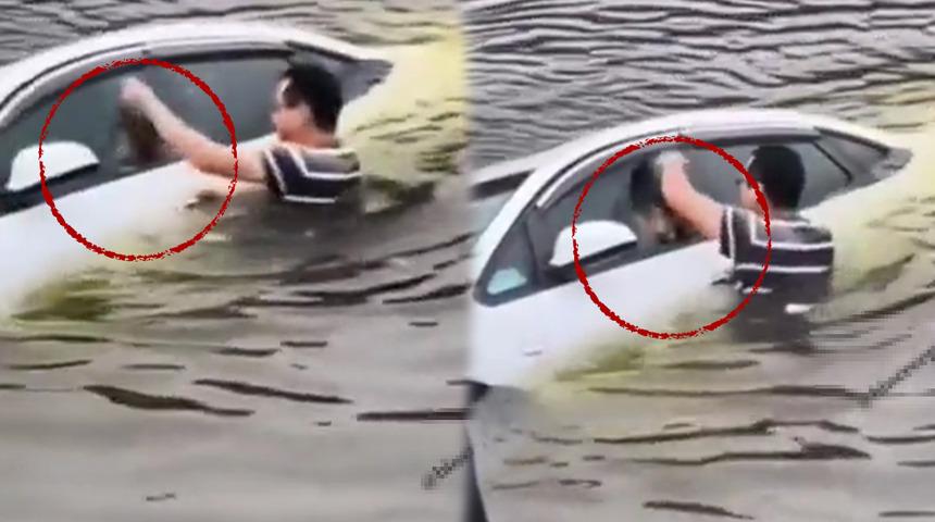 Sosyal medyada gündem olan görüntüler! Aracın içine sıkışan köpeği canı pahasına kurtardı