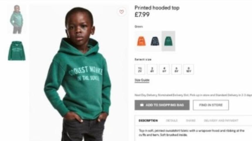 D&uuml;nyaca &uuml;nl&uuml; markadan siyahi &ccedil;ocuğa giydirilen ırk&ccedil;ı giysi i&ccedil;in a&ccedil;ıklama