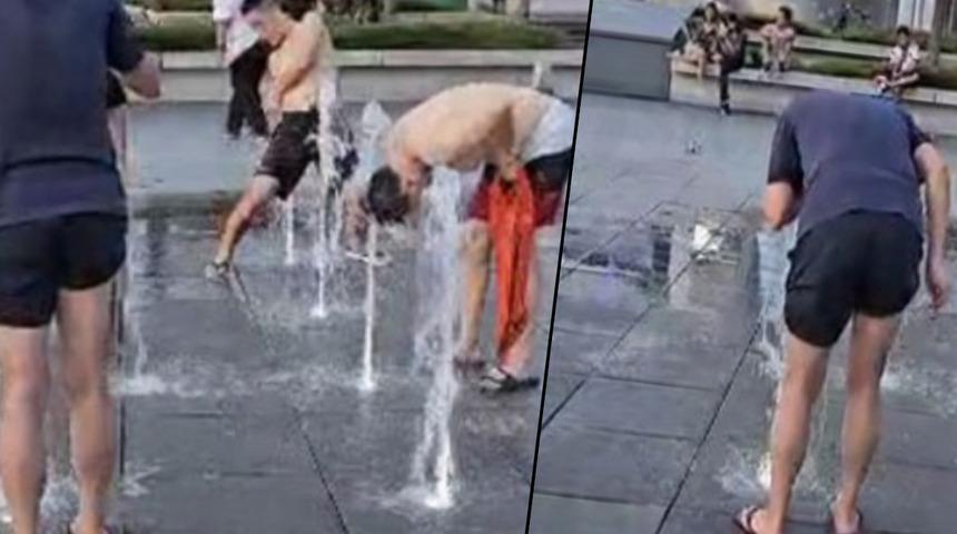 Gören duruma anlam veremedi! Meydanın ortasında resmen duş aldılar... Koltuk altlarını ve cinsel organlarını çekinmeden yıkadılar