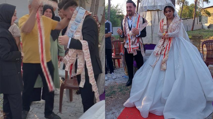 Düğünde takılan takı herkesi şaşkına çevirdi! 100 metre uzunluğunda 'Hesapladığıma göre...' Paraları zor saydılar