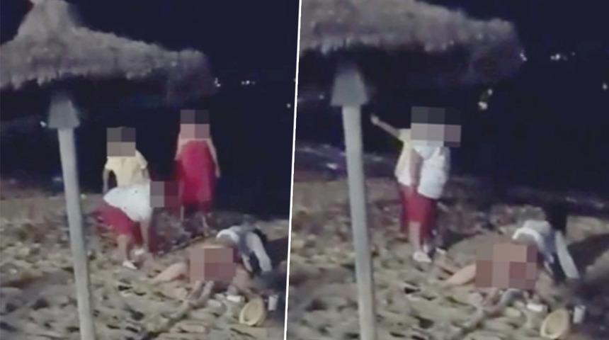 Sahilde cinsel ilişkiye giren çifti görünce öfkeden deliye döndüler! Önce terlikle dövdüler, sonrasında ise üzerlerine kum attılar