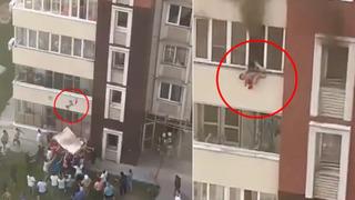 Korku dolu anlar! Alevler her yeri sardı... Çocuğunu kurtarmak için hiç düşmeden 30 metrelik pencereden aşağıya attı