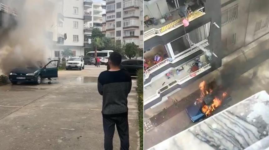 Yanan araca, balkondan b&ouml;yle m&uuml;dahale etti! Kova kova su d&ouml;kt&uuml;