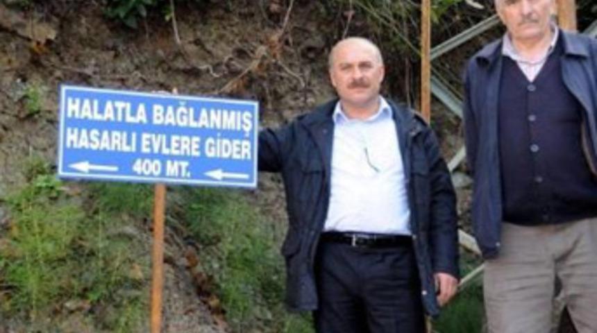 Halatla bağlanmış hasarlı evlere gider!