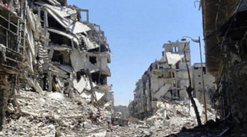 Esad g&uuml;&ccedil;leri Halep'e bomba yağdırdı